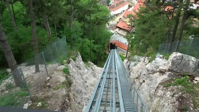 The track runs between rocks towards the Citadel